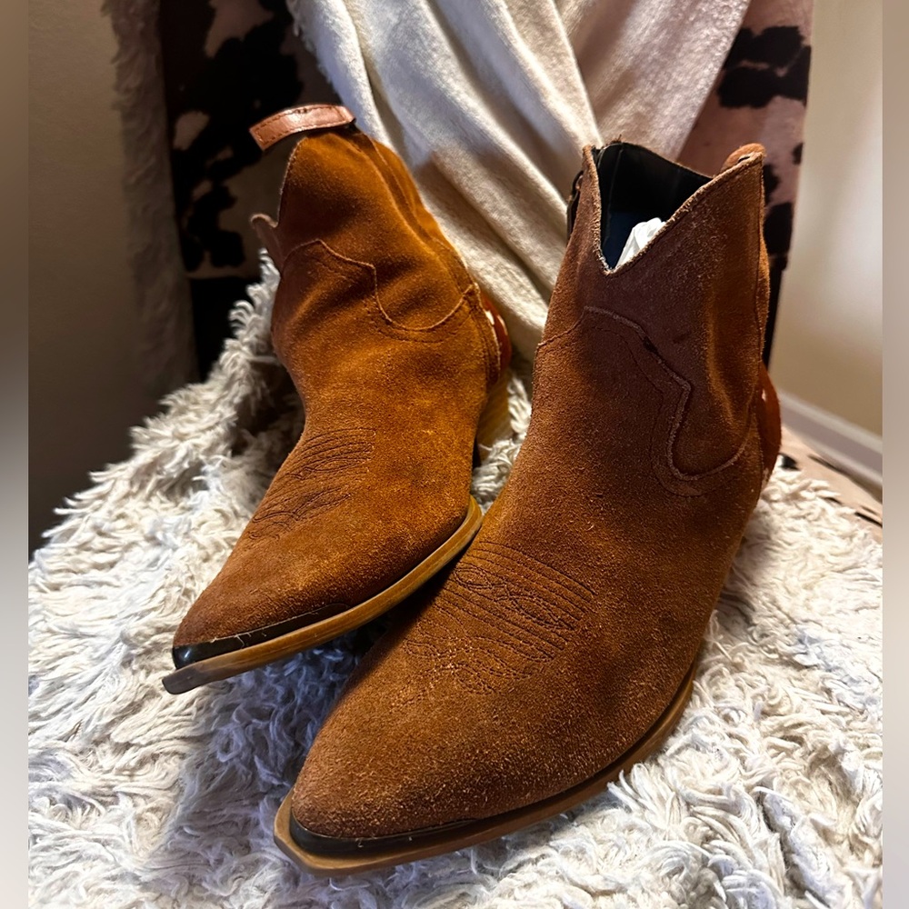 Brown ankle cowgirl boots with brown cow print on heel